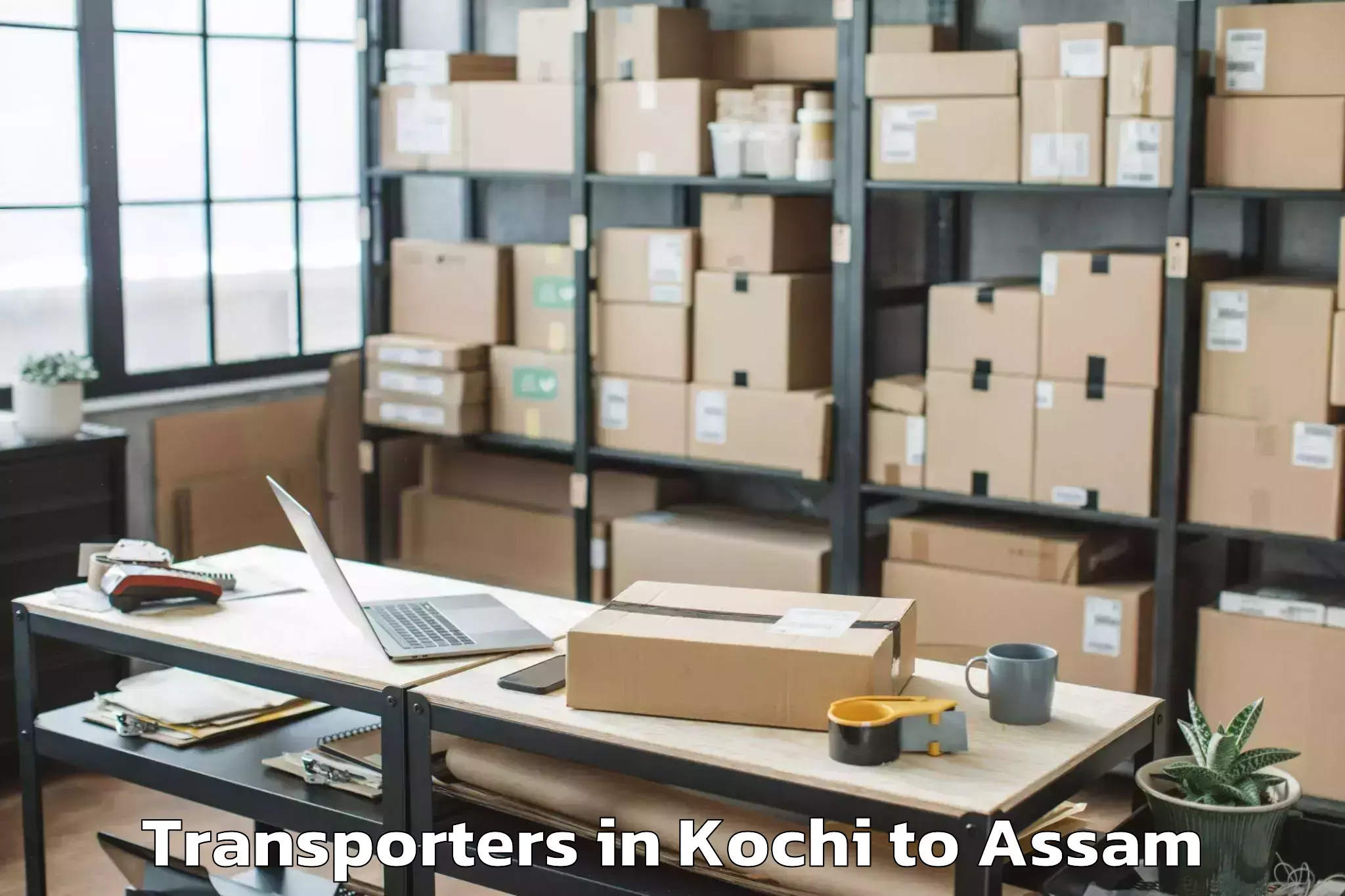 Top Kochi to Baganpara Transporters Available